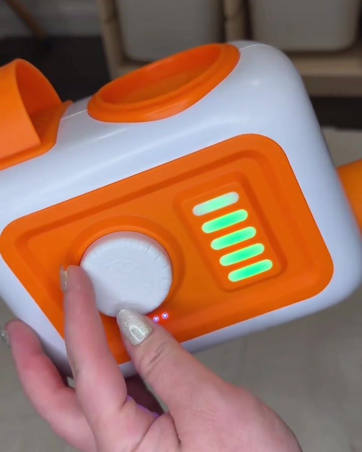 A finger pressing the EVO's airflow lights and dial